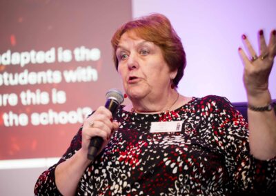 Lorraine Petersen OBE with her hand in the air explaining how to reduce SENCO workload.