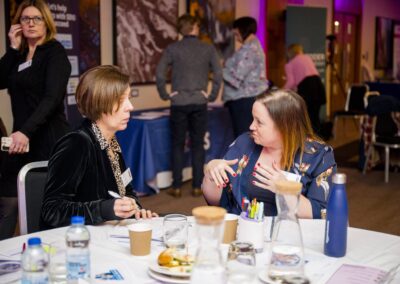 Author Ginny Bootman attending the SENsible24 SENCO Conference, having a discussion with another SENCO. In the background Provision Map by TES are speaking to another SENCO.