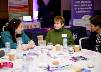 Julie Cassiano and Alison Steele speakers at the SENsible24 SENCO Conference talking to a SENCO around the table.